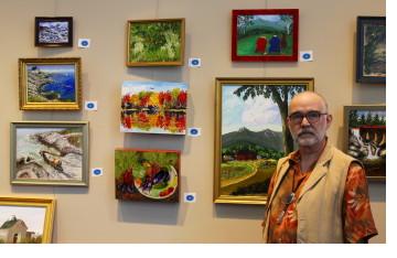 Dr. Stephen A. Kull displays some of his paintings at Androscoggin Valley Hospital in Berlin, NH